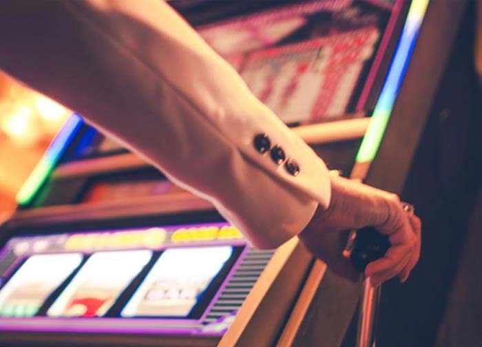 Person playing slot machine